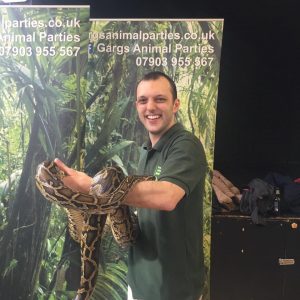 Man holding up a snake