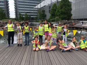 Kids posing for a picture on a bridge