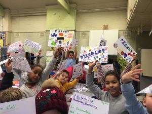 Kids showing their drawings from a Piccolo Party